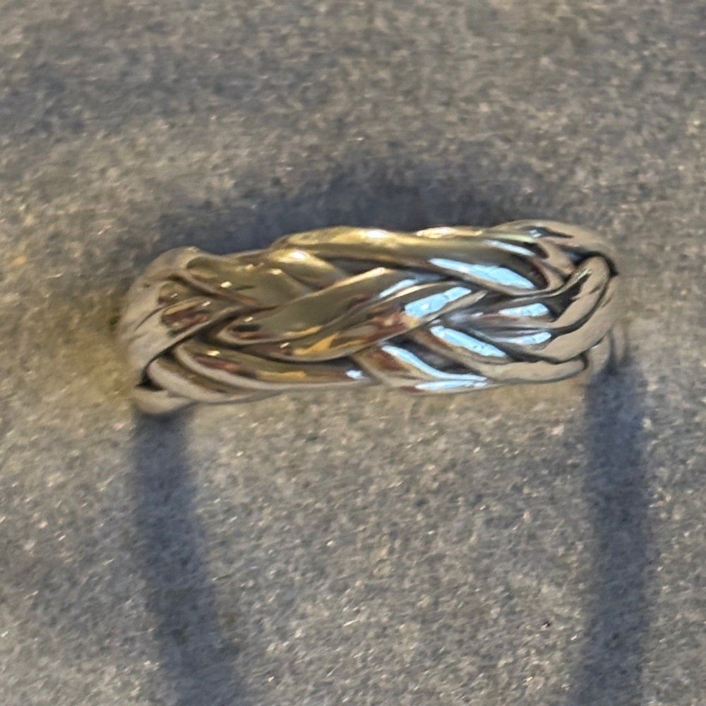 Elegant Silver Braided Ring Sz.7 has open seam on inside of ring but not outside
